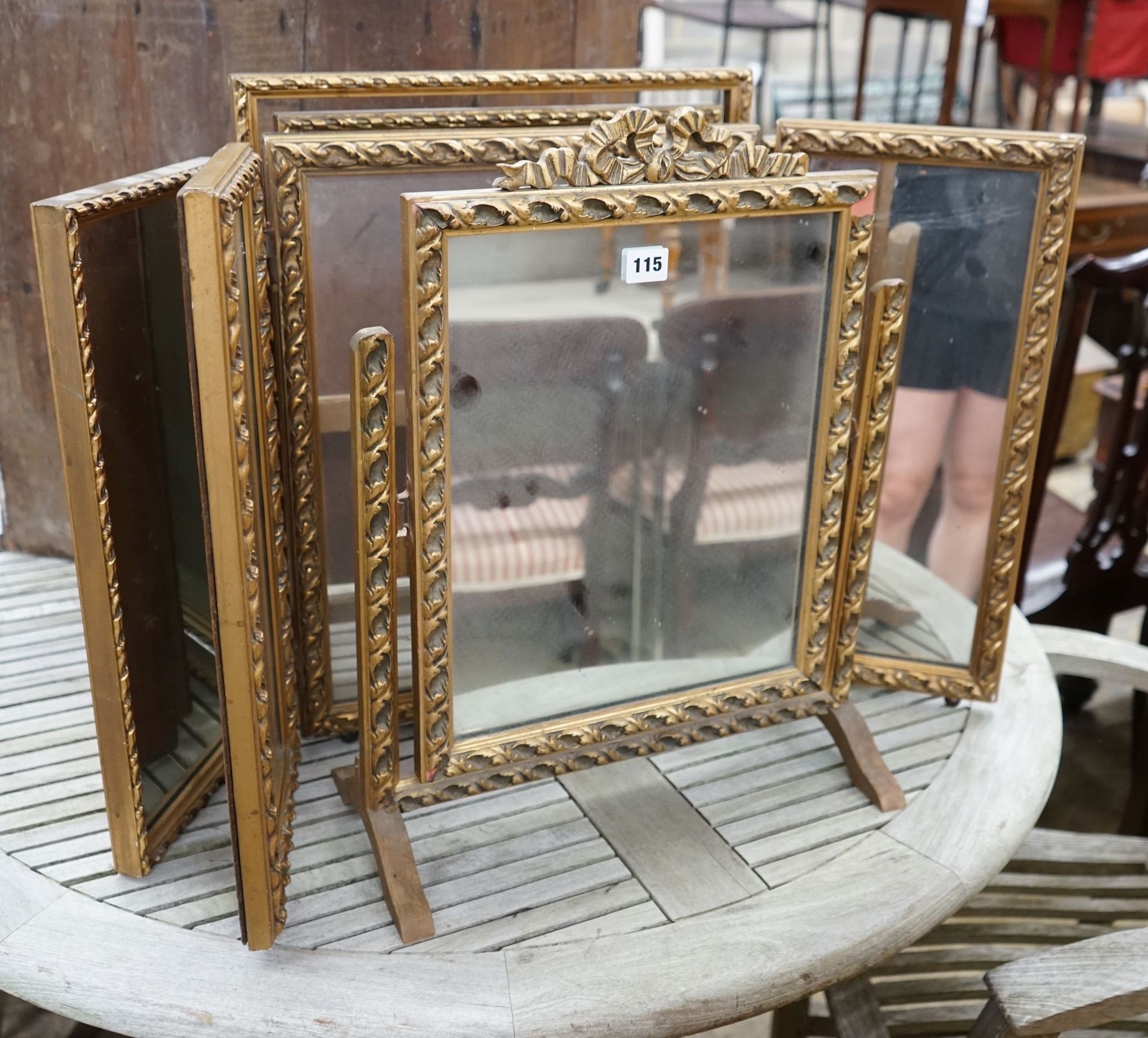 Two gilt framed triple dressing table mirrors together with a similar toilet mirror, largest height 52cm